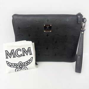 MCM Limited Edition Black Embossed Leather Wristlet